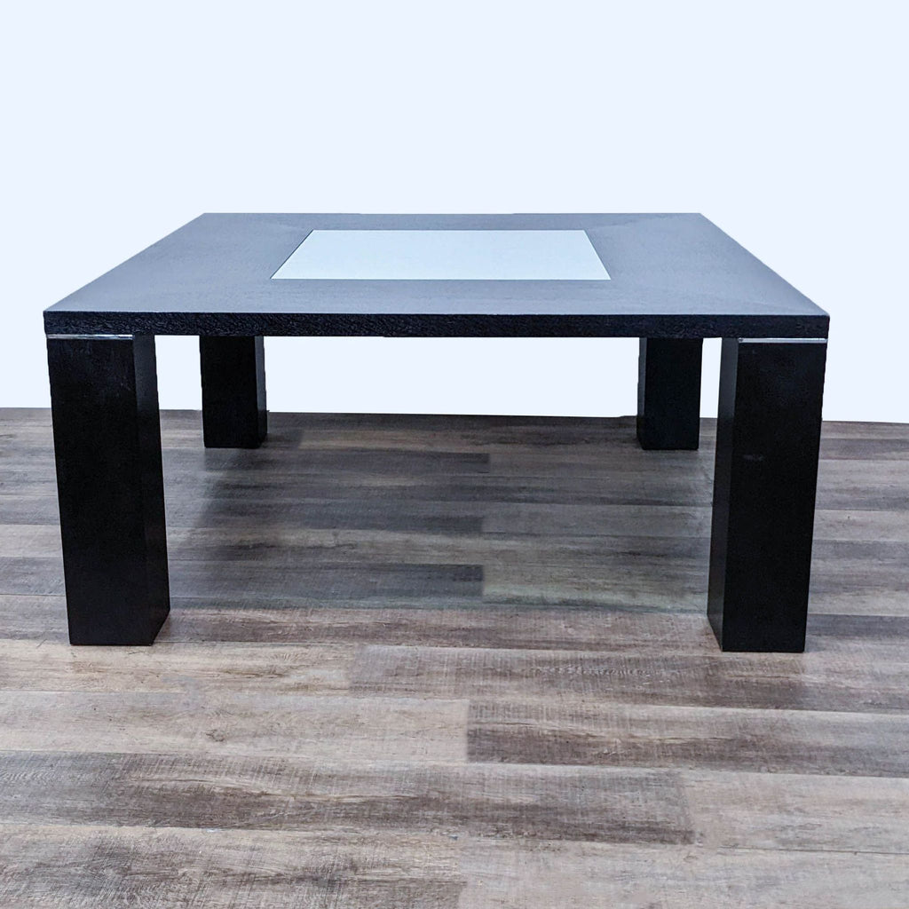 Square dining table with block legs, featuring a sandblasted glass insert for contrast. Elegant wenge finish.  