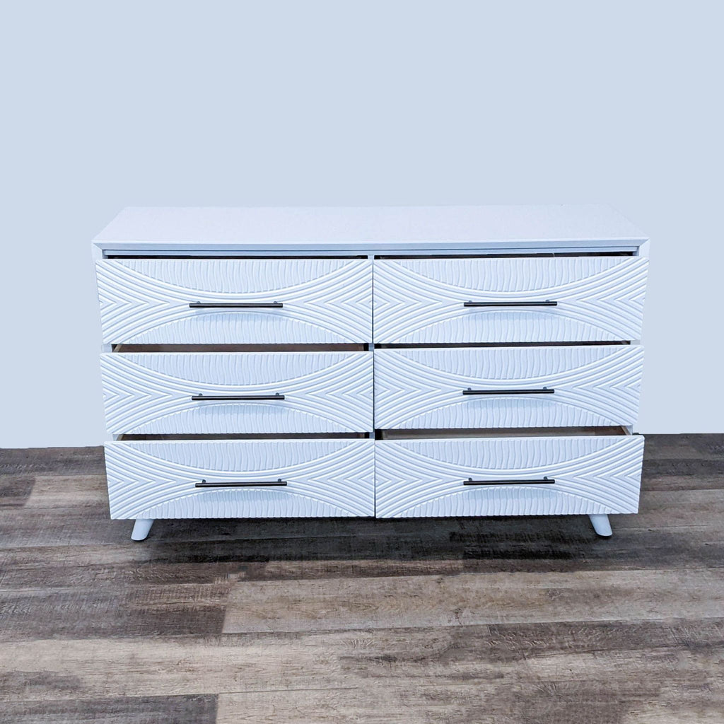 Front view of Tranquility dresser with six textured drawers. 