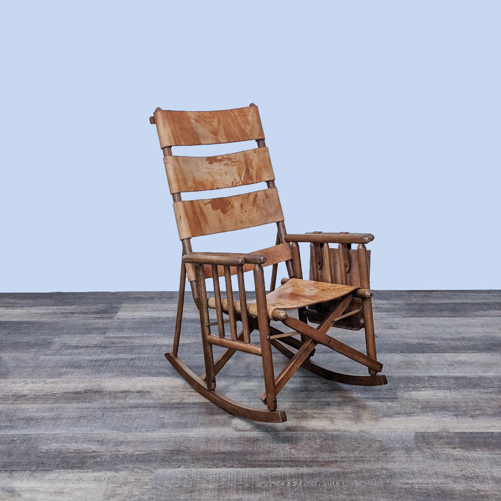 Costa Rican mid-century folding rocking chair with leather seat and side pouch.