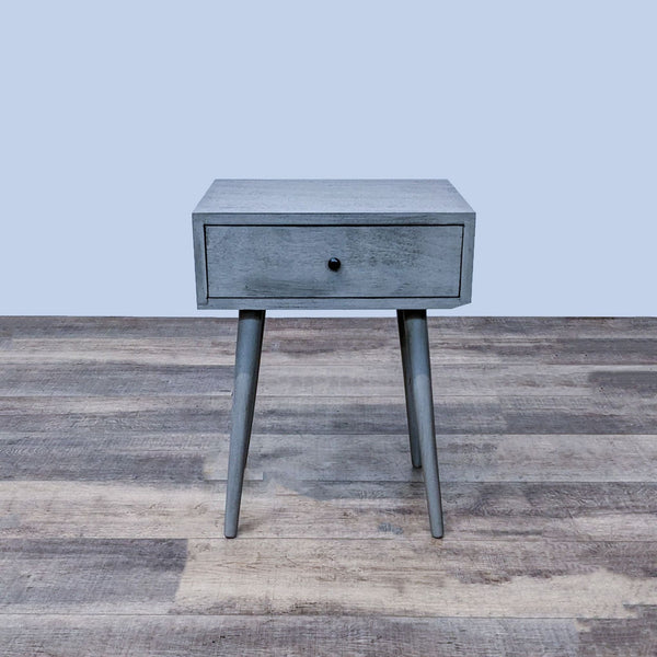 Reperch end table with single drawer and angled legs in gray finish.