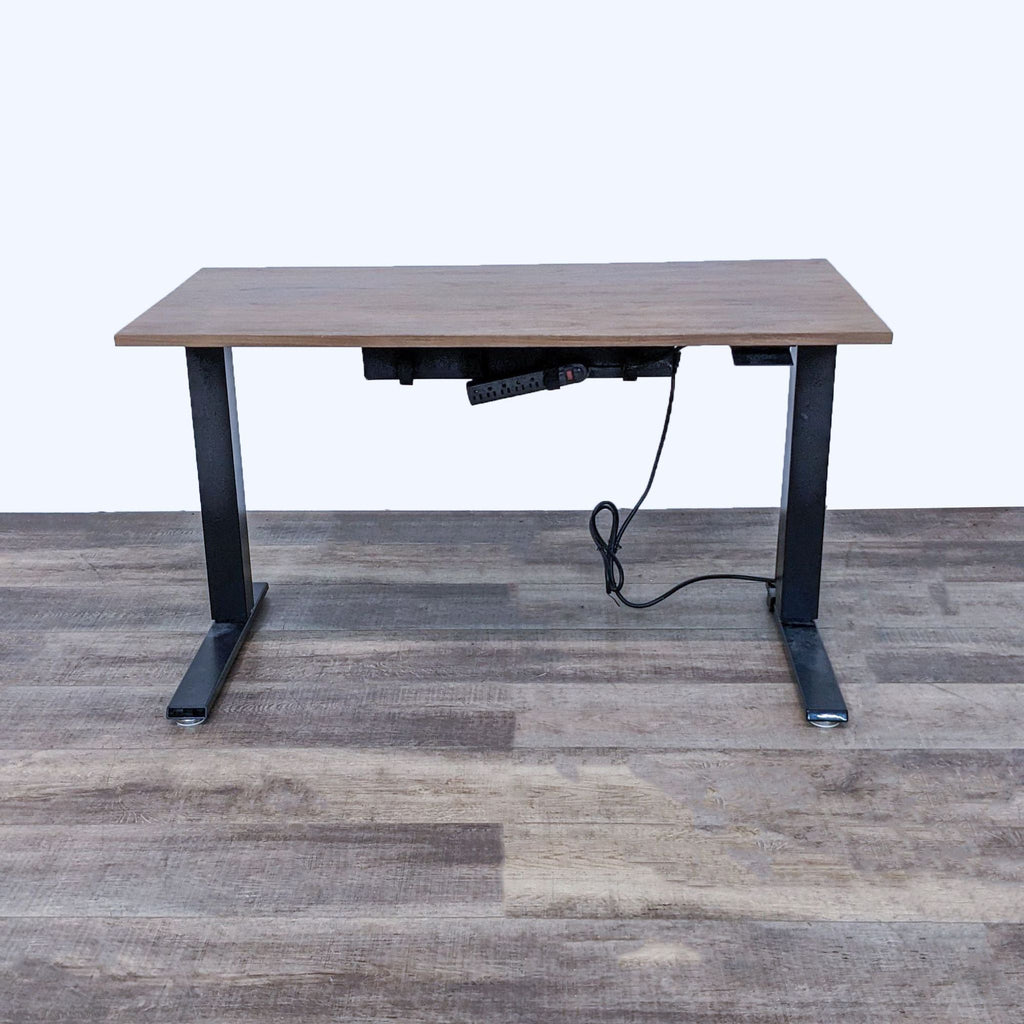 Desk with wood finish top, black steel legs, motorized control not working.