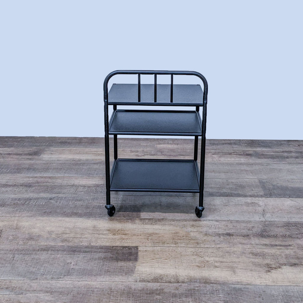 Ikea end table on wheels, featuring two shelves and a sleek black finish.