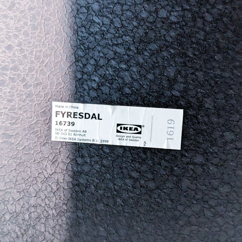 Close-up of the Ikea label featuring the brand and model details.