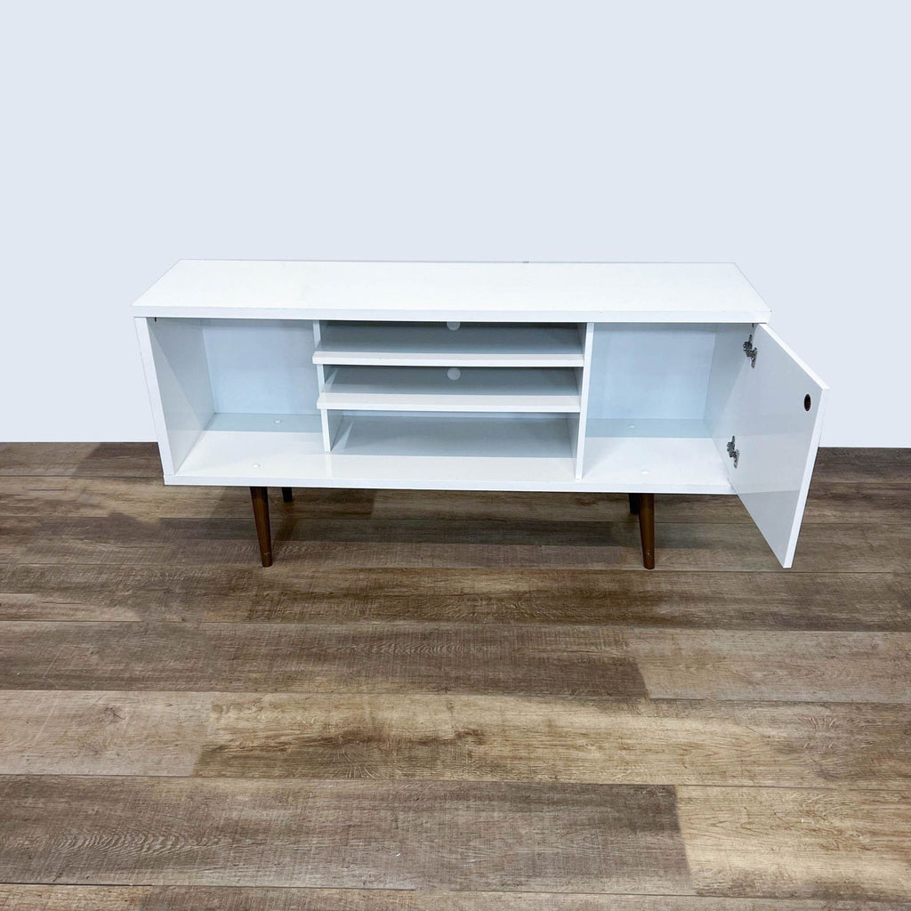 Reperch entertainment center in white, featuring open shelving and a patterned cabinet door.