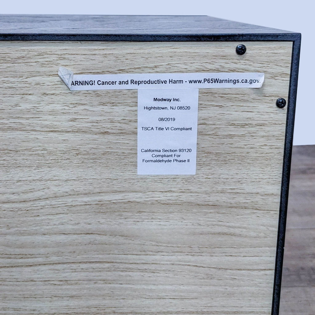 3. Close-up of the compliance label on the back of the Modway end table describing safety and formaldehyde information.