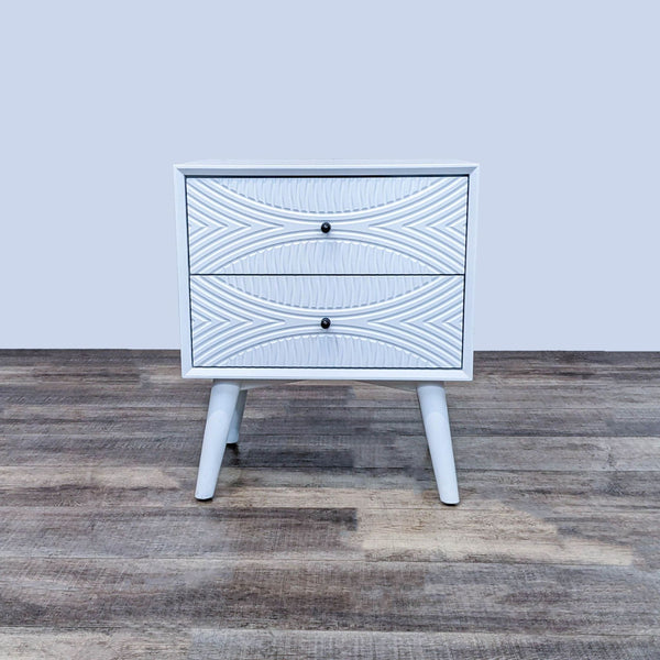 Mid-Century white end table with geometric drawer fronts and angled legs by Reperch.