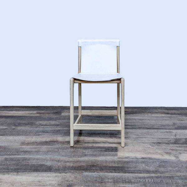 White leather sling stool with ashwood frame, front view.
