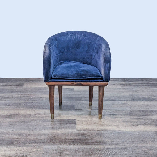 Viceroy accent chair in sapphire velvet with wood and brass legs, designed by Leonhard Pfeifer.