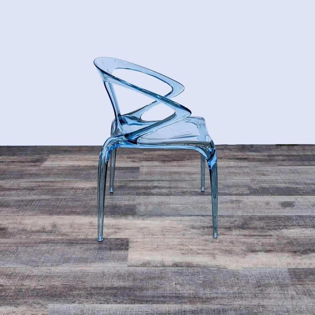 Side view of the lightweight, stackable AVA chair with a unique design.