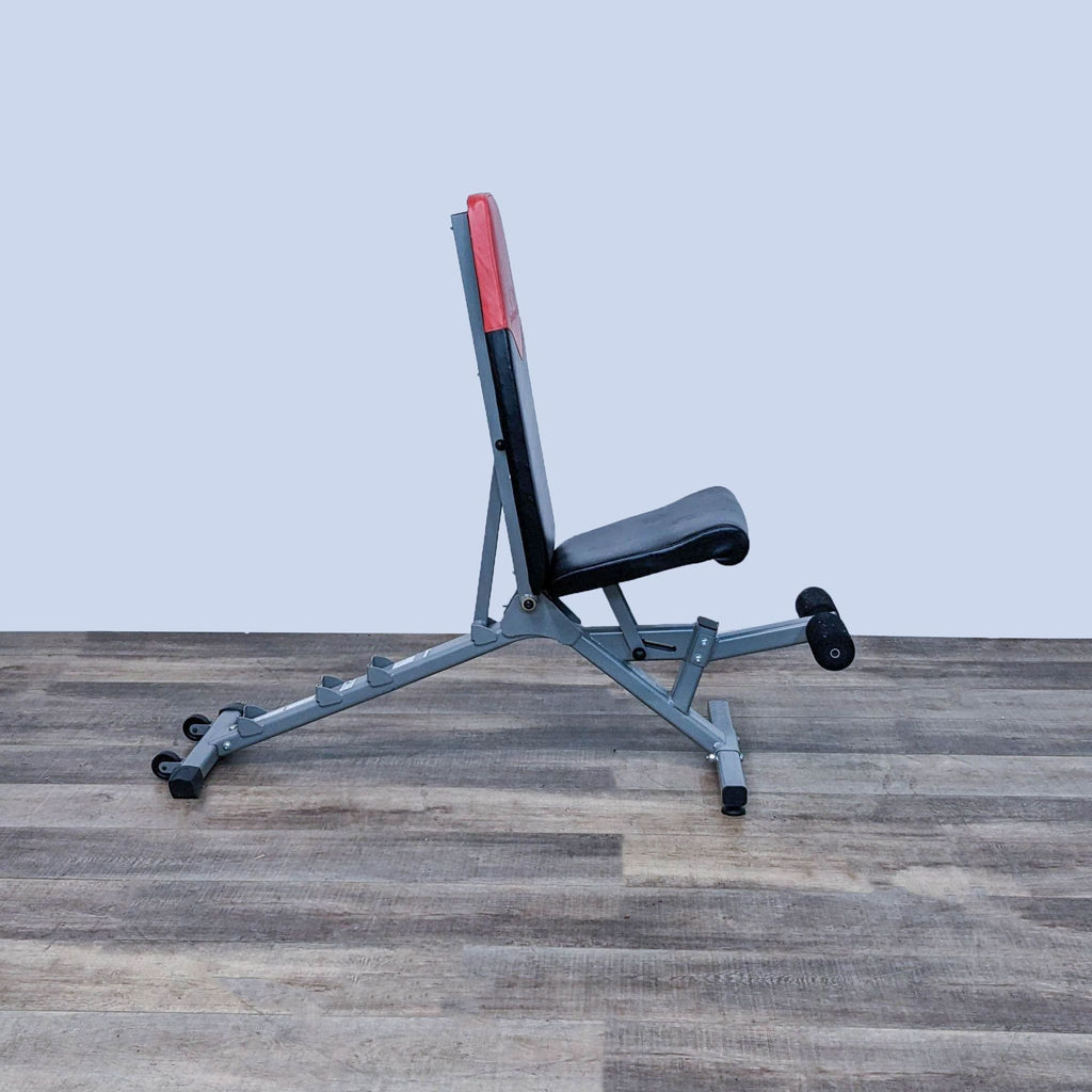 2. Bowflex adjustable workout bench shown in upright seated position, side view.