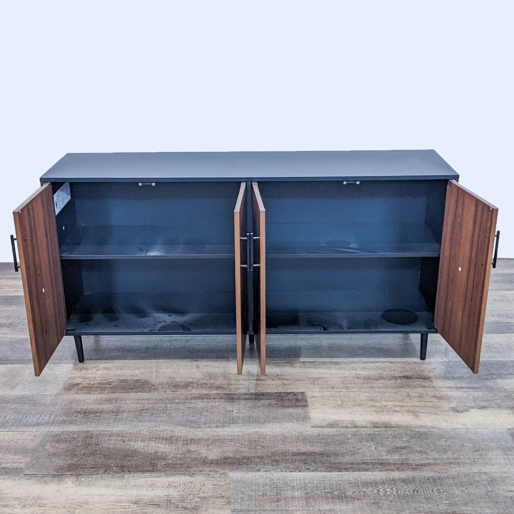 Interior view of sideboard showing adjustable shelves inside open cabinets.