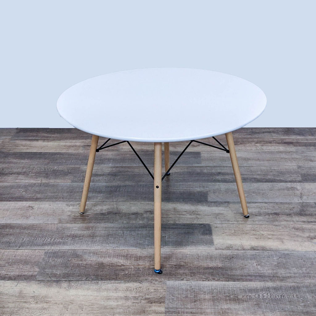 the coffee table is a modern coffee table with a round top and a metal base.