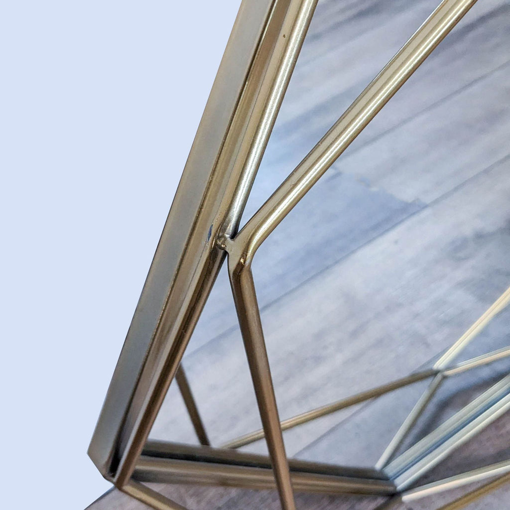 Close-up of the golden octagonal frame detailing.