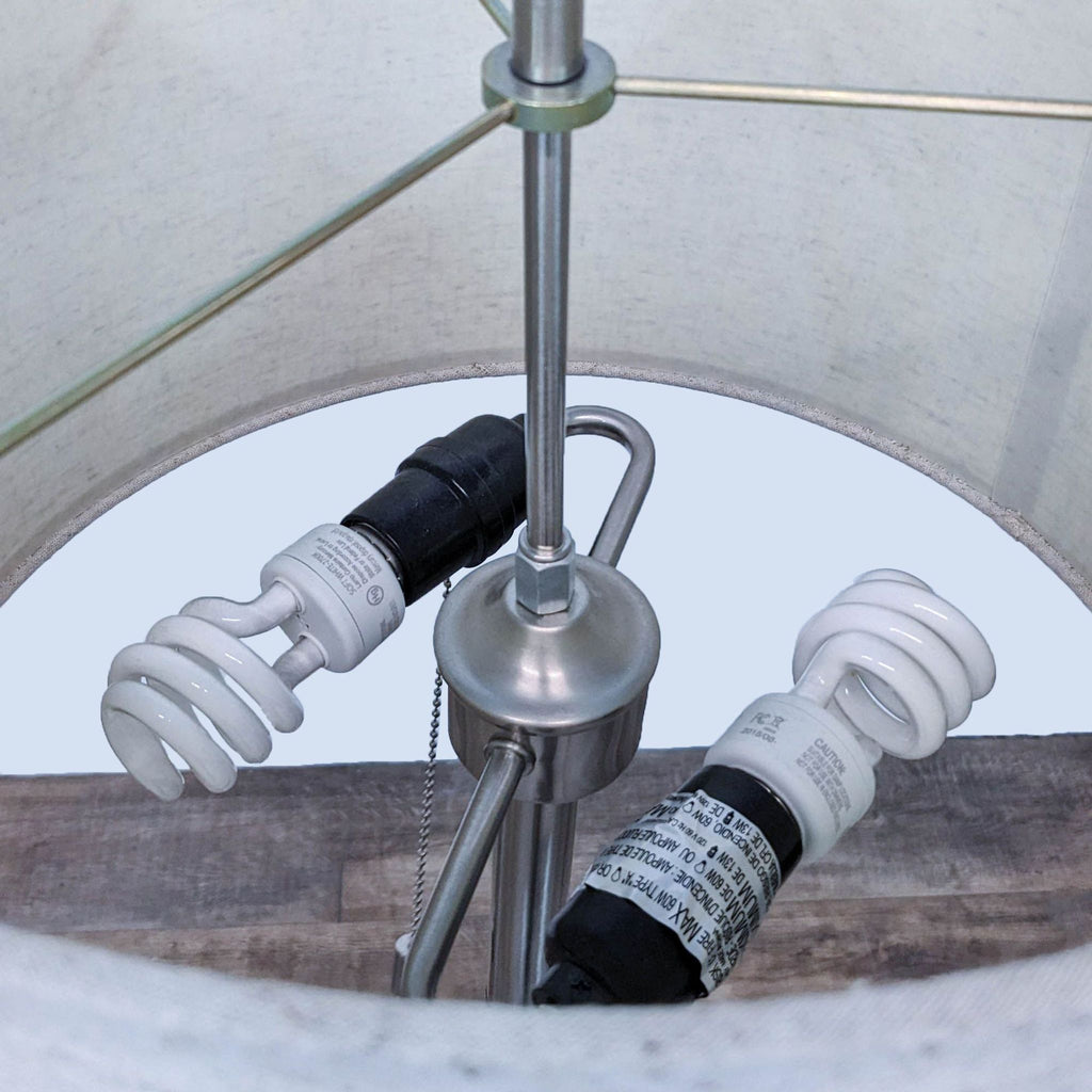 Close-up of the lamp's interior with two spiral CFL bulbs.