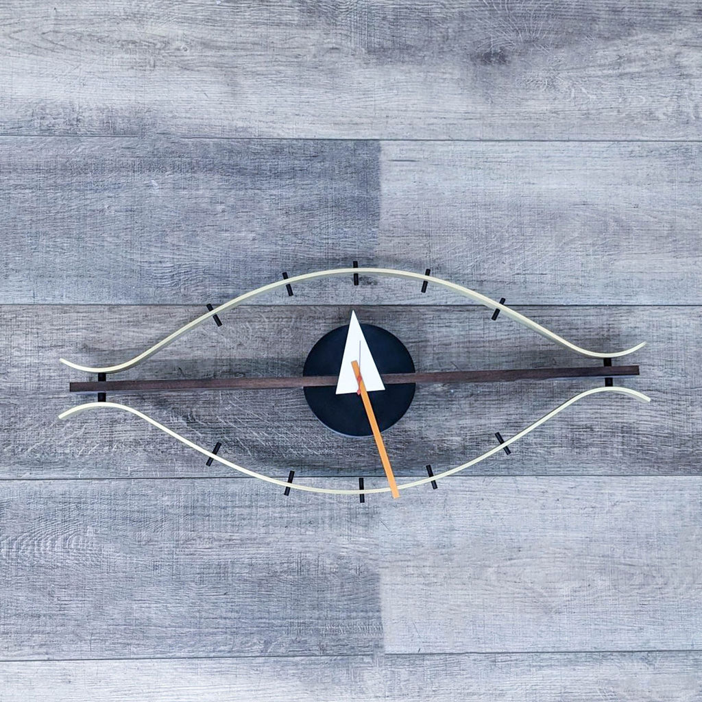 Vitra Eye Clock by George Nelson, featuring a sleek, sculptural design with quartz movements.