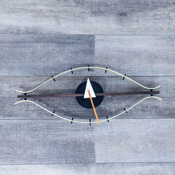 Vitra Eye Clock by George Nelson, featuring a sleek, sculptural design with quartz movements.