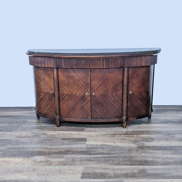 a mahogany sideboard with a black marble top.