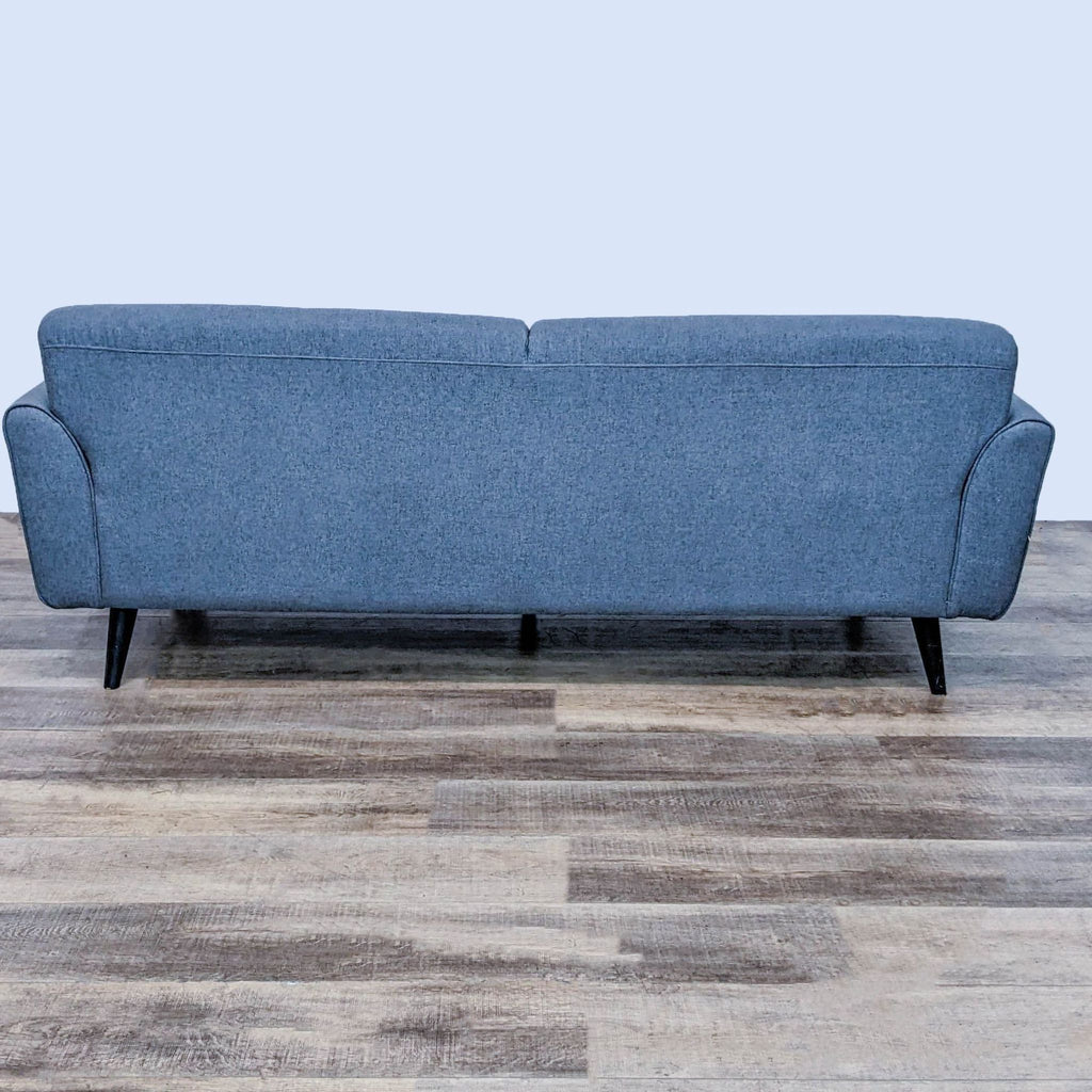 Back view of Ace Brand sofa, highlighting its streamlined silhouette and style.