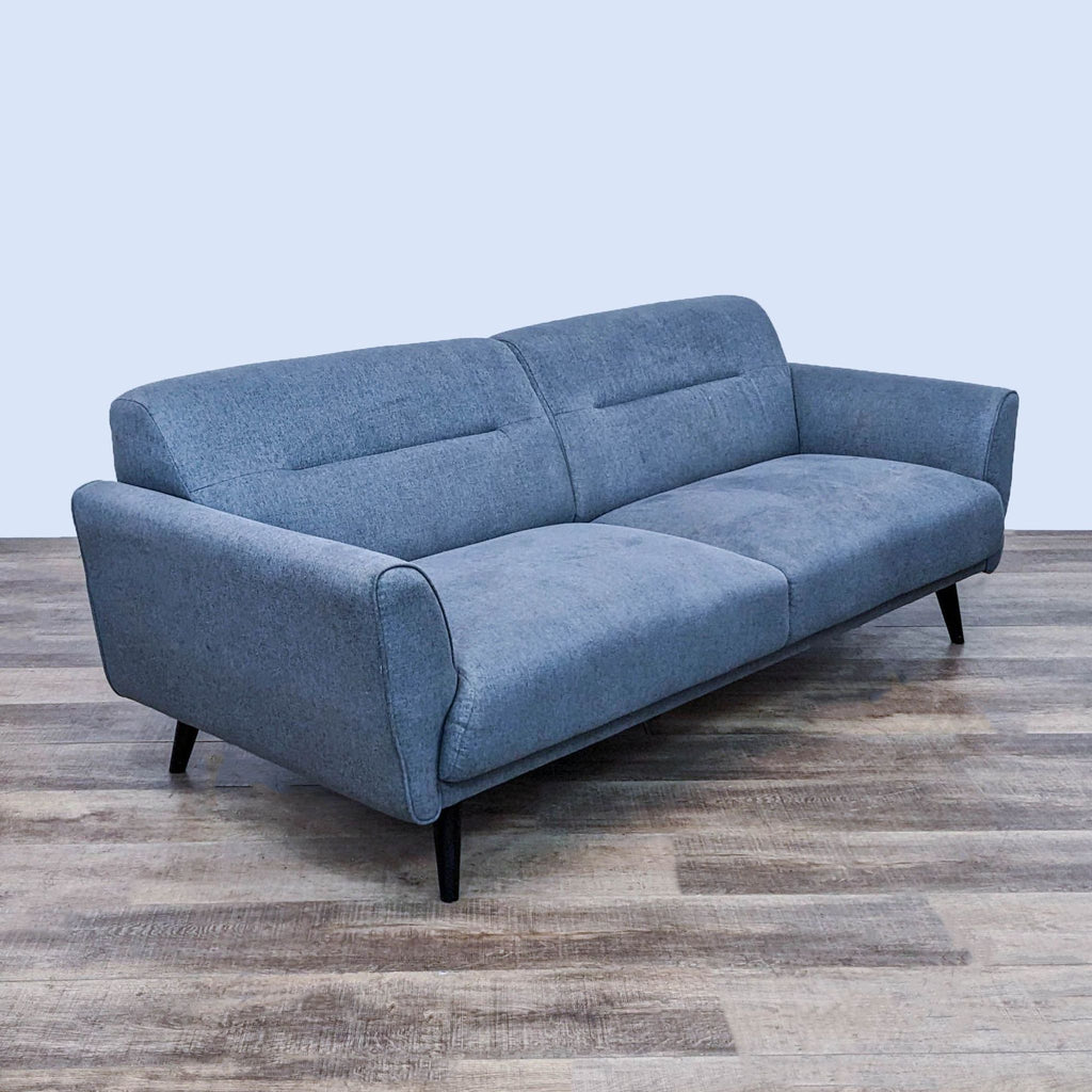 Side view of 3-seat blue sofa, emphasizing its clean lines and comfort.