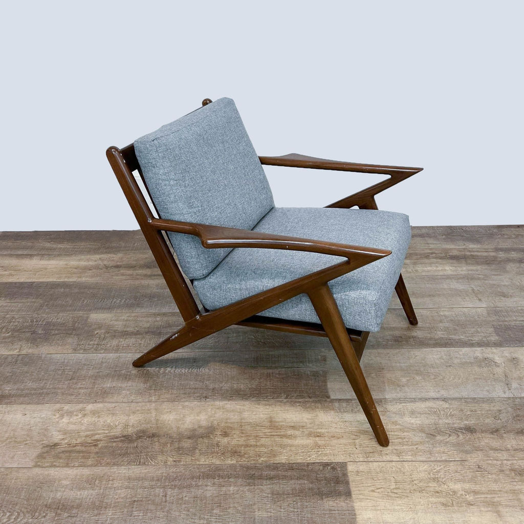 Side view of accent chair with walnut finish and angled design.