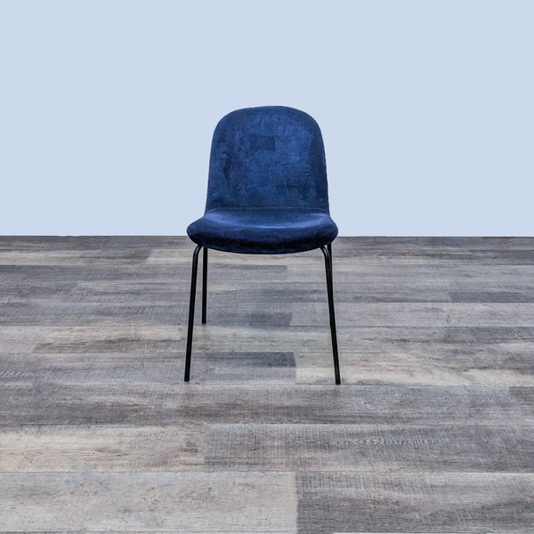 Front view of the Primativo side chair by CB2 with navy blue velvet seat and black steel frame.