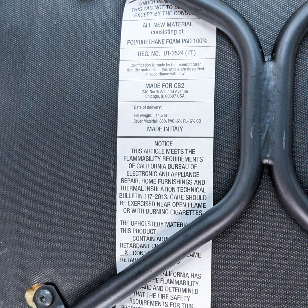 Close-up of the label on the Primativo side chair, detailing materials and Italian craftsmanship.