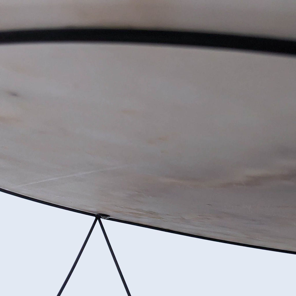 Underside view of the Reperch table highlighting the wireframe structure.  