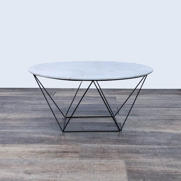 Round Reperch coffee table with marble top and geometric metal base.   
