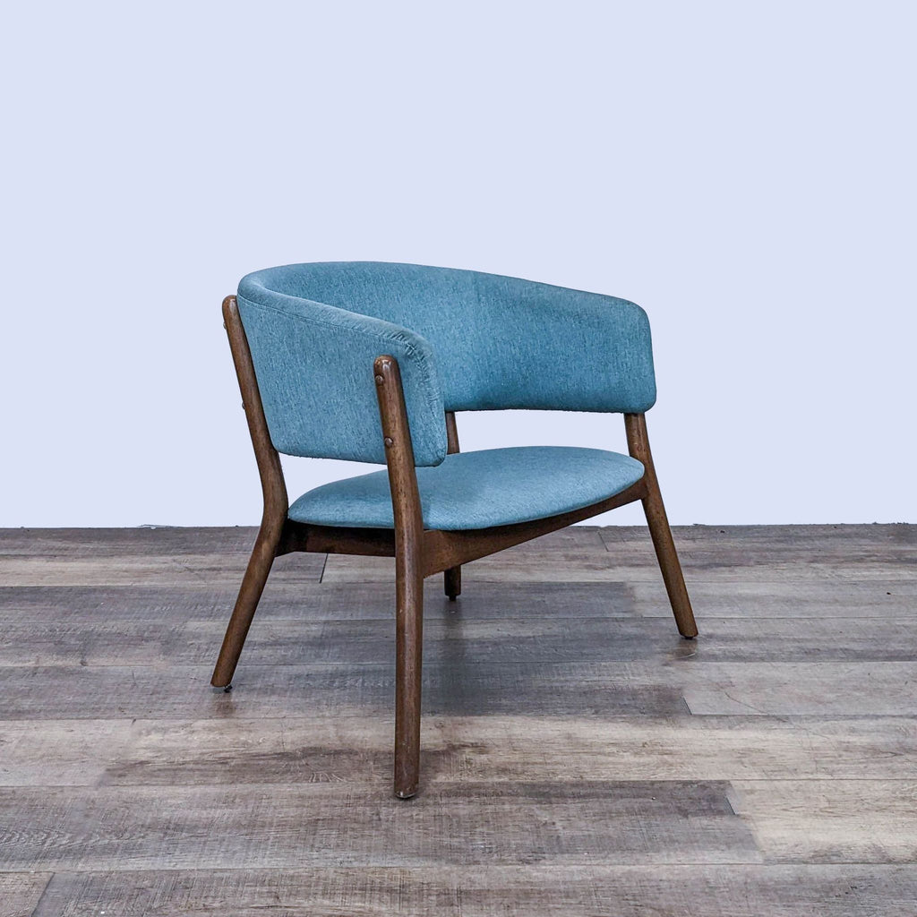 Side view of the Chapel chair by Zuo Modern with wooden frame and blue fabric, showcasing its retro style.