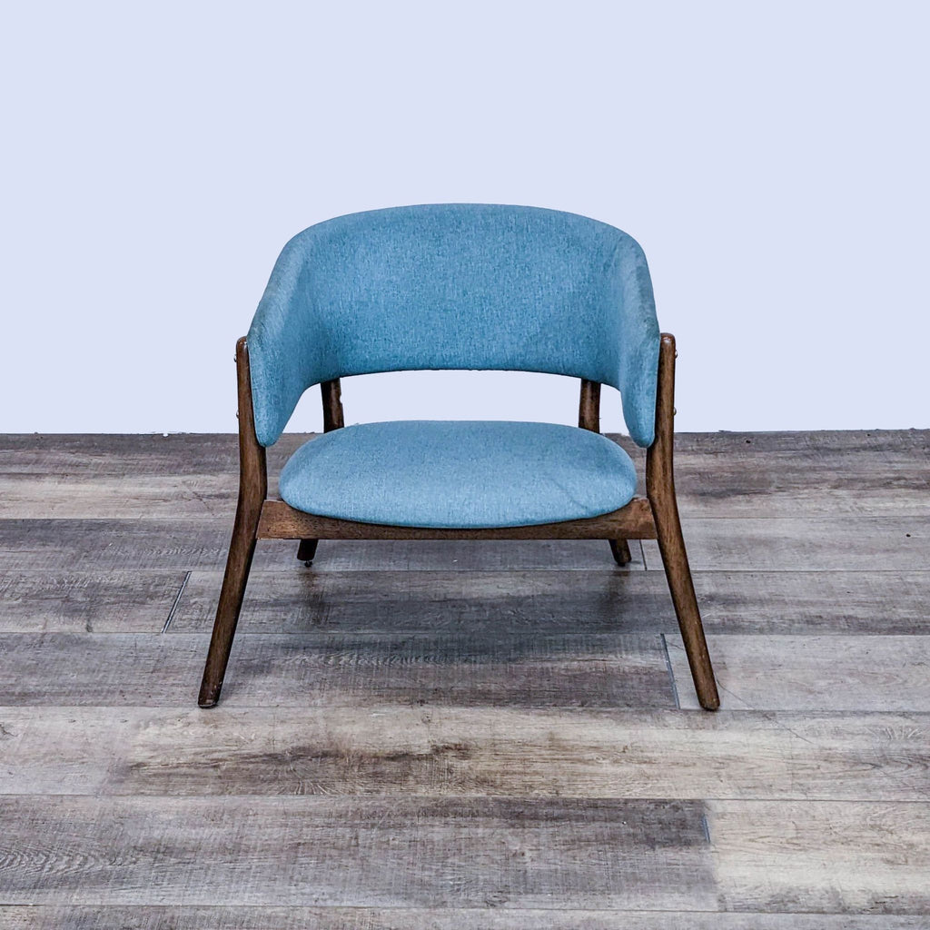 Front view of blue Mid-Century Modern chair by Zuo Modern. Solid wood frame and fabric seat.  