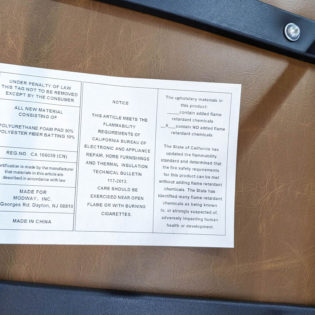 Close-up of Modway dining chair label detailing material and safety information.