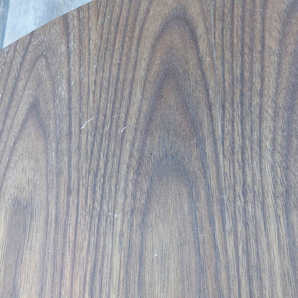 Close-up of wooden grain texture on the coffee table surface.