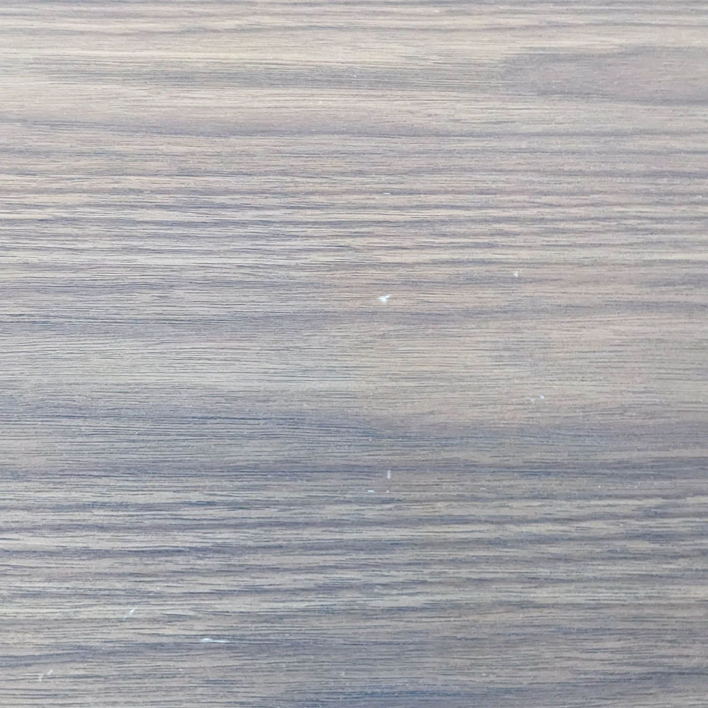 Detailed shot of the smooth wooden finish on the table top.