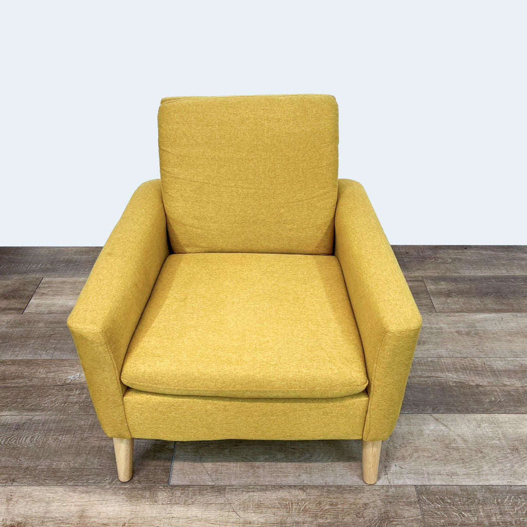 Reperch lounge chair with yellow upholstery and soft seat.