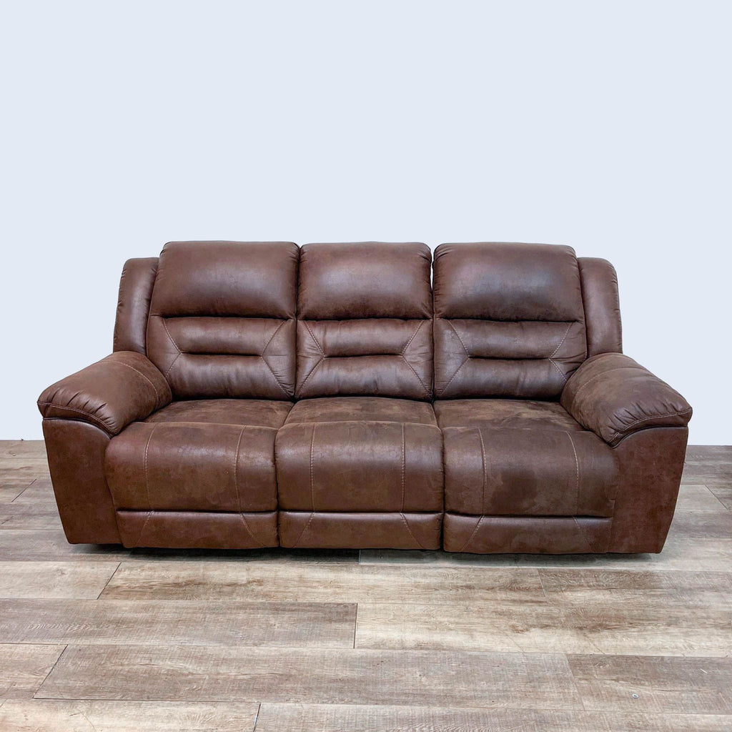Saddle brown leather 3-seat sofa with pillow top arms and high back by Reperch.