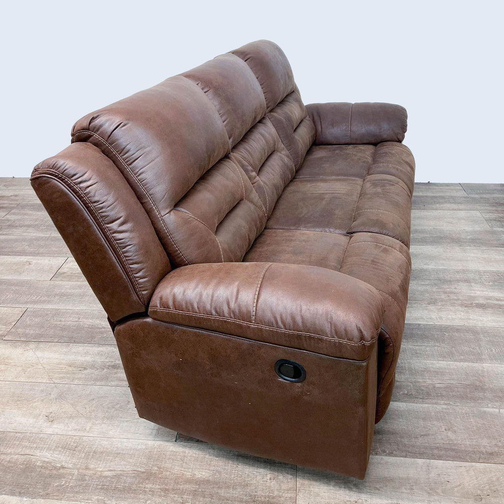 Side view of 3-seat Reperch sofa, highlighting pillow top arms and sleek leather design.