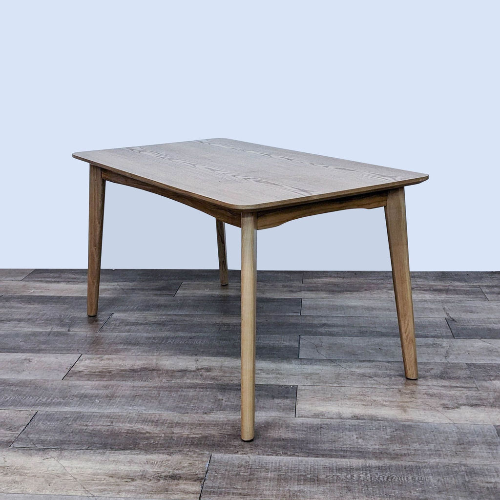 Wooden dining table by Reperch featuring clean lines and a natural finish, mid-century design.