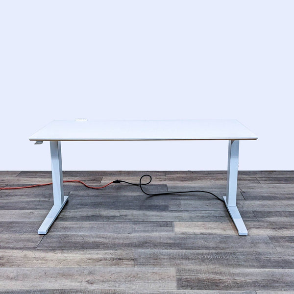 Motorized white desk with steel frame, measuring 58 inches.