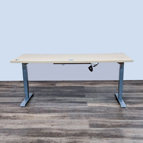 Light finish desk with gray steel base, motorized height adjustments.