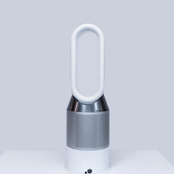 Dyson bladeless fan with a sleek white and silver finish on a table.