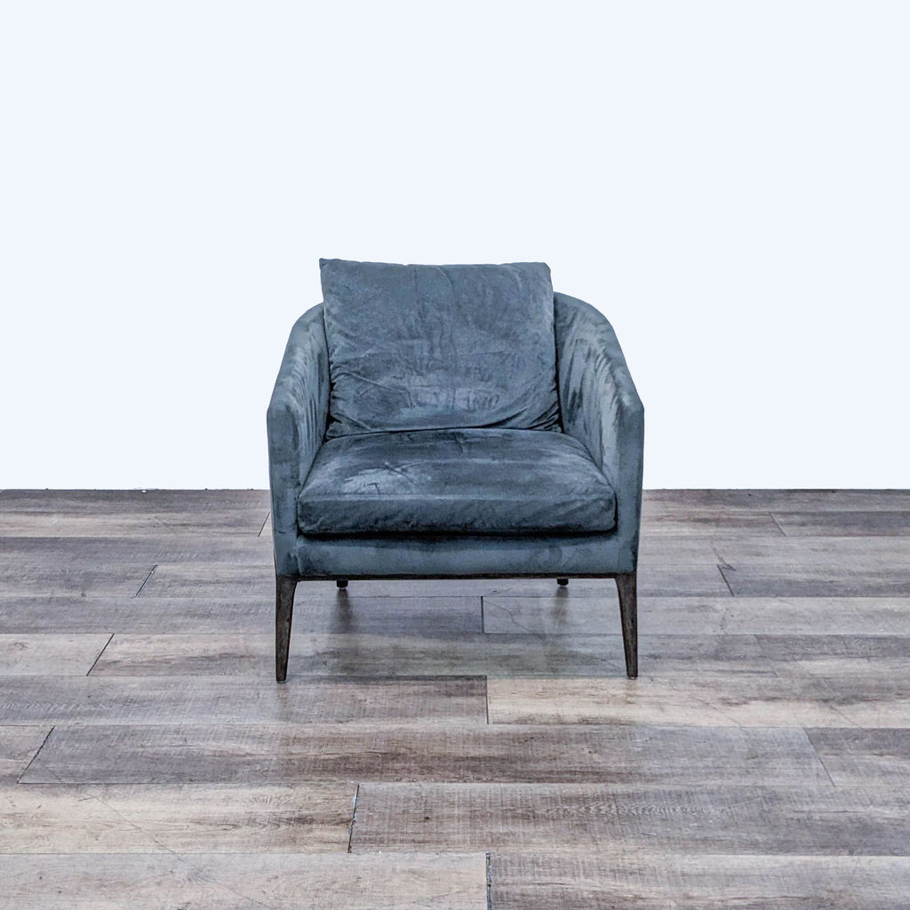 Front view of the Copeland chair in grey upholstery with black oak frame.