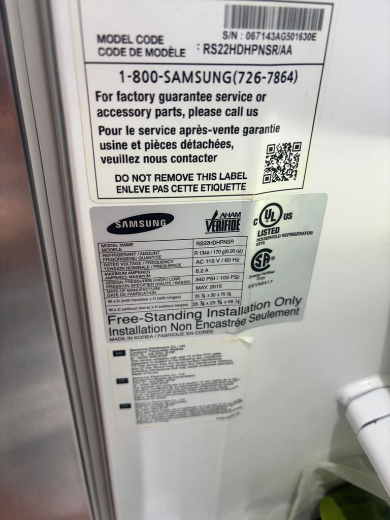 Modern stainless steel refrigerator with double doors and sleek handles.