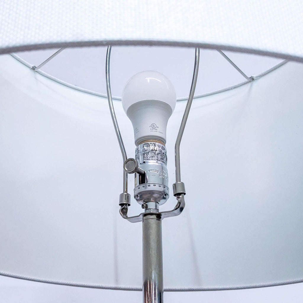 Interior view of Reperch lamp showing bulb and fittings under the shade.