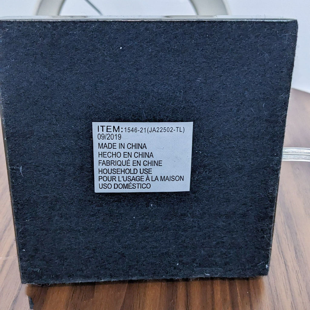 Black lamp base with label: "Item:1546-21, Made in China, Household Use."