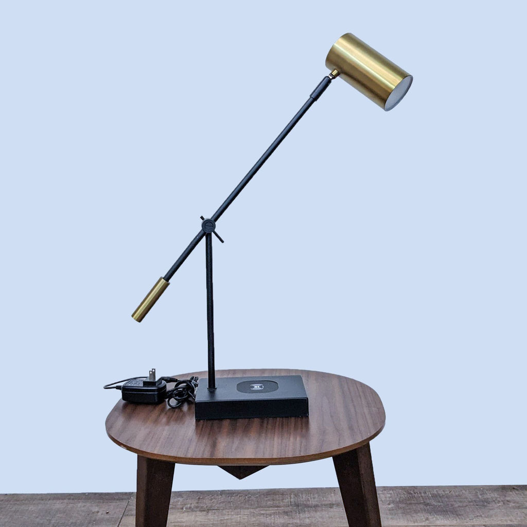 Adjustable Reperch lamp with wireless tech on a wooden table.