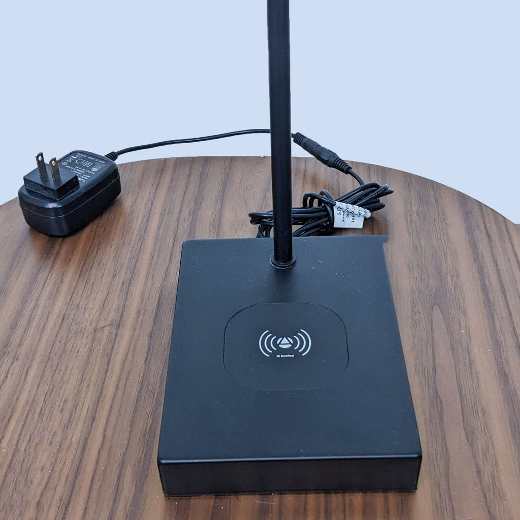 Close-up of Reperch lamp base featuring wireless technology.