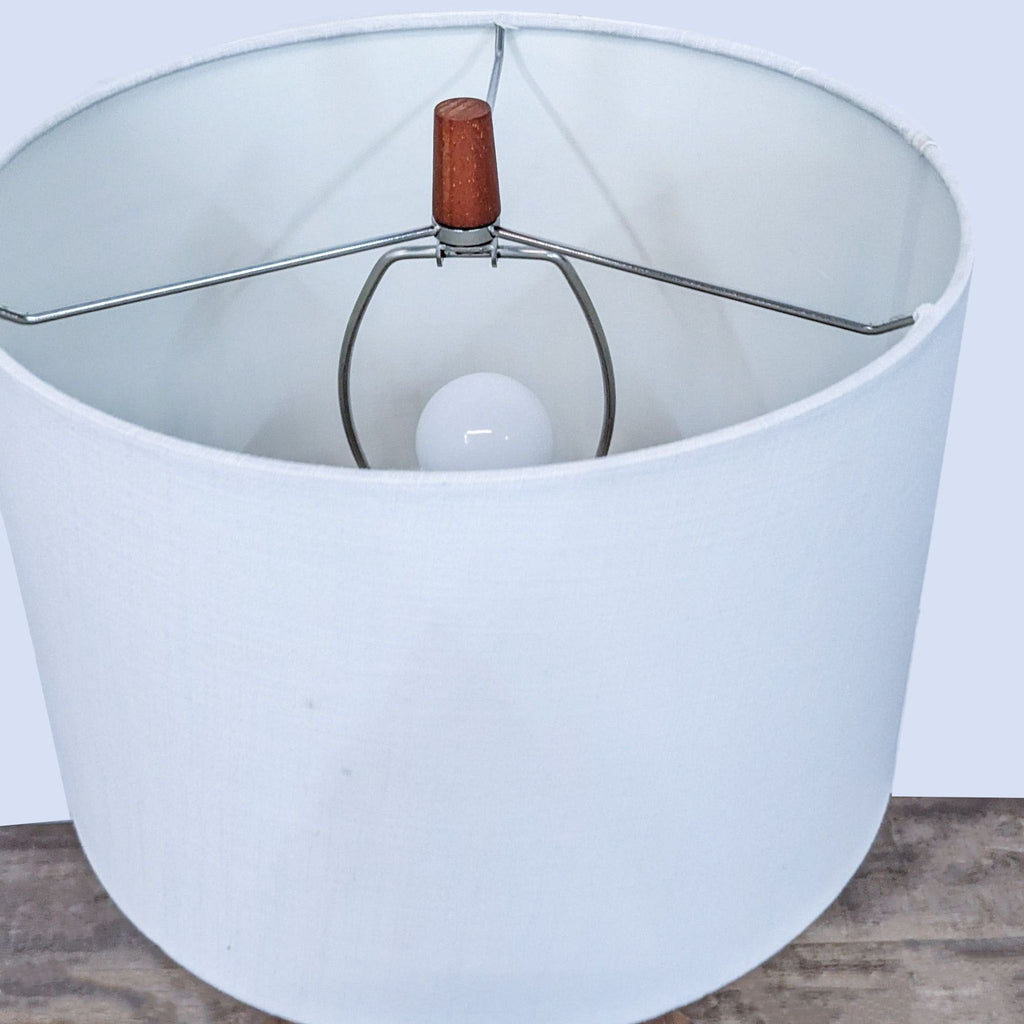 a glass bowl with a small hole in it 