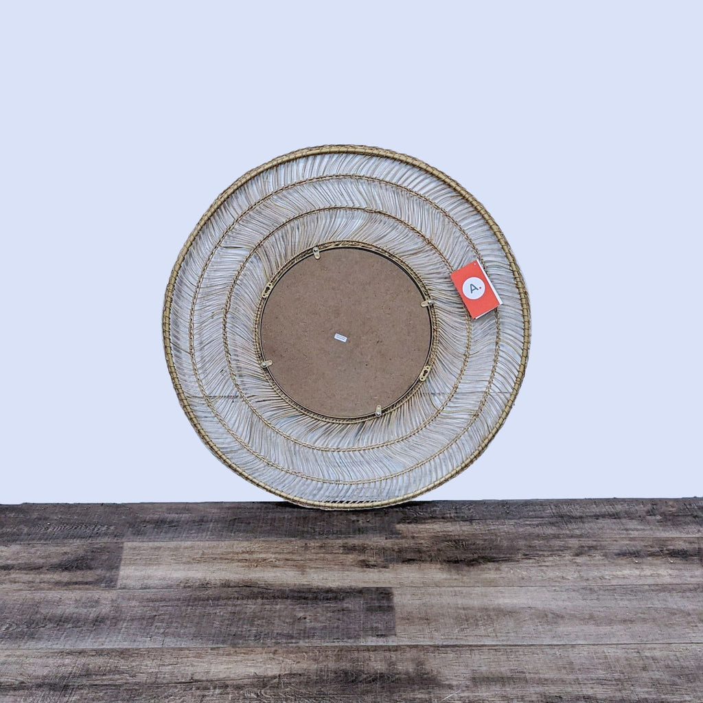 Back view of the Meron mirror by Article, showcasing its circular woven frame.