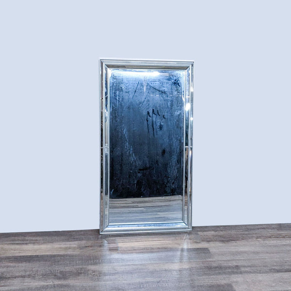 Elegant wall mirror by BP Industries with a double beveled mirrored frame featuring silver beaded trim.