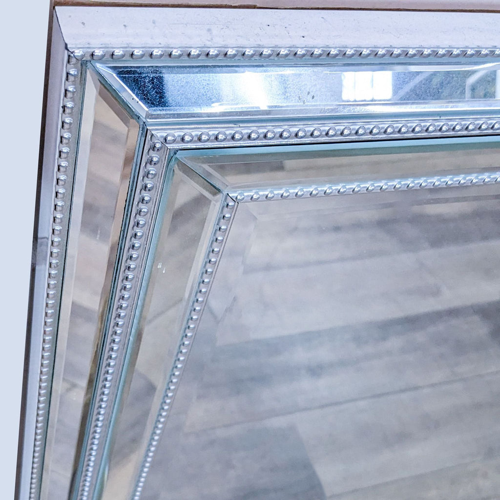 Close-up of the BP Industries mirror highlighting the silver beaded trim and double beveled frame detail.